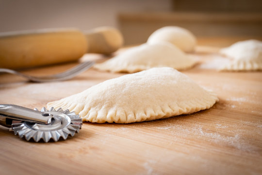Close up of panzerotto ready to be fried. Traditional street food of Puglia, Italy