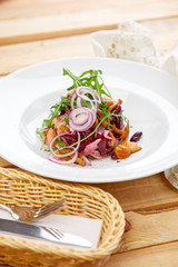 vegetarian salad with beetroot, honey agaric and red onion