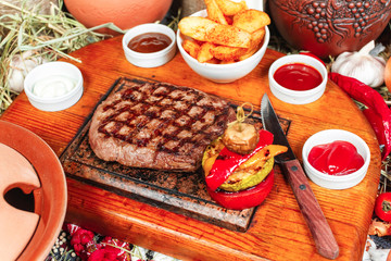  Grilled steak with sauces, fresh vegetable salad and mashed potatoes Georgian recipe. National cuisine