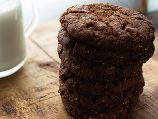 milk oatmeal cookies on wooden background