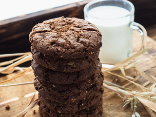 oatmeal cookies oats and milk on a wooden background
