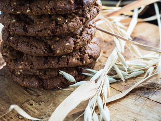 oatmeal cookies oats and milk on a wooden background