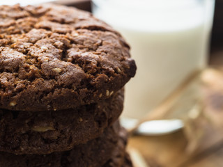 oatmeal cookies oats and milk on a wooden background
