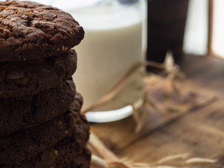 oatmeal cookies oats and milk on a wooden background