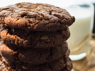 oatmeal cookies oats and milk on a wooden background