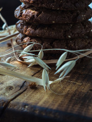 oatmeal cookies oats and milk on a wooden background