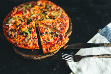 Pizza and tableware   on black background