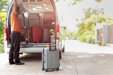 Travel van with luggage leaving for holidays on sunny day in summer.