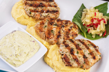  Fried fish patties served with vegetables, salad and greens and mashed potatoes according to Georgian recipe