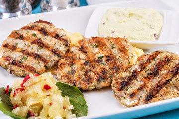  Fried fish patties served with vegetables, salad and greens and mashed potatoes according to Georgian recipe