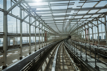 tunnel of monorail road view from front window of a moving train running