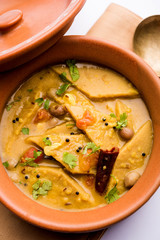 Dal Dhokli, Varan Phal or Chakolya is a gujarati, Rajasthani and maharashtrian dish made using diamond shape wheat flour cakes boiled in a dal. It's an easy one pot meal. served in a bowl.