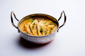 Dal Dhokli, Varan Phal or Chakolya is a gujarati, Rajasthani and maharashtrian dish made using diamond shape wheat flour cakes boiled in a dal. It's an easy one pot meal. served in a bowl.