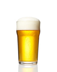 Glass of beer on white background
