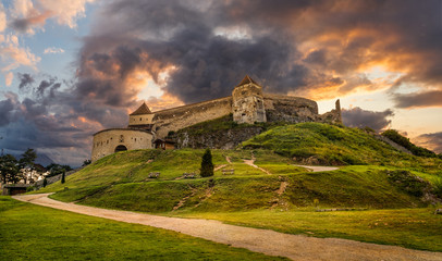 Landscape with Medieval fortress Rasnov at sunset, Brasov, Transylvania, Romania