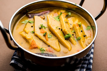 Dal Dhokli, Varan Phal or Chakolya is a gujarati, Rajasthani and maharashtrian dish made using diamond shape wheat flour cakes boiled in a dal. It's an easy one pot meal. served in a bowl.