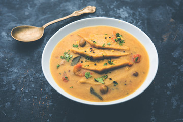 Dal Dhokli, Varan Phal or Chakolya is a gujarati, Rajasthani and maharashtrian dish made using diamond shape wheat flour cakes boiled in a dal. It's an easy one pot meal. served in a bowl.