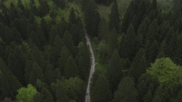 Aerial dron shot of mountain bikes on a road
