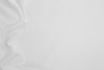 Obraz premium Smooth elegant white silk or satin luxury cloth texture as wedding background. Luxurious background design