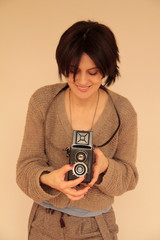 young girl with old camera