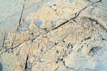 Cracked stone surface. The texture of granite.