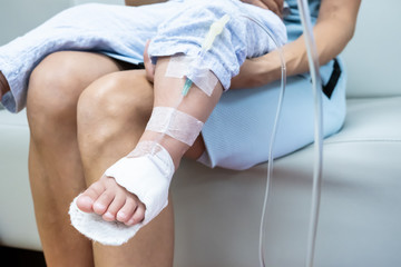 Fototapeta premium mom and crying little daughter in the hospital. Little girl is injected. 