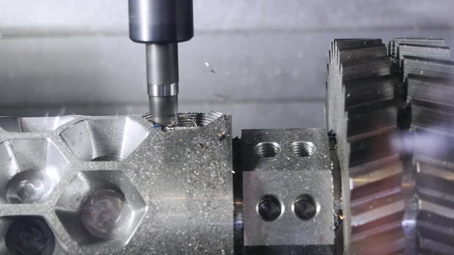 Metalworking cutting process by milling cutter. Media. CNC machine processes metal detail. Close-up of the metal workpiece processing on the latest machine