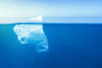plastic bag floating at water, iceberg metaphor