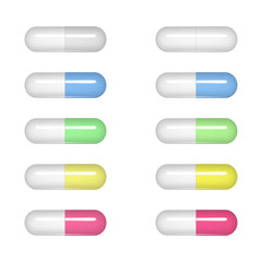 Vector realistic image of tablets (pills, vitamins) of oval shape, white, blue, yellow and pink colors. Image was created using gradient mesh. Vector EPS 10.