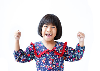 Joyful little girl cheering, shouting with hands up, isolated on wthite background