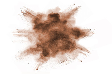 Brown powder explosion isolated on white background.
