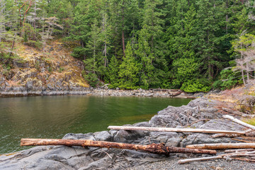 Fototapeta na wymiar Fragment of Mountain Lake with Green Water in British Columbia, Canada.