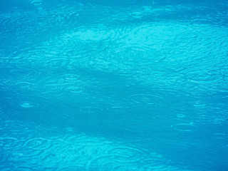 Obraz premium the surface of swimming pool and water expanding ripple effect background.
