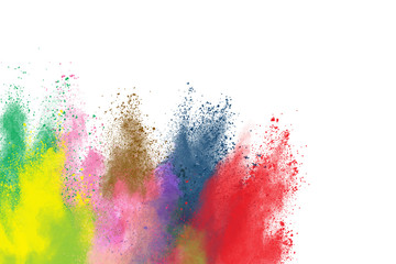 Freeze motion of colorful color powder exploding on white background.  Paint Holi.