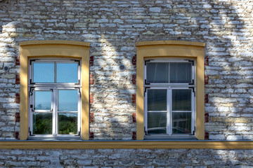 Windows on a stone wall.