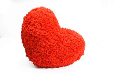 Red heart pillow on white background