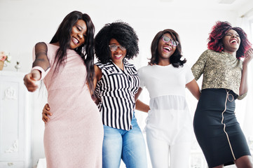 Four best friends. Young adrican women loud laugh, having fun and spend time together.
