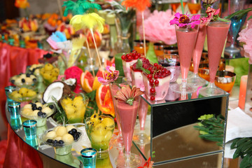 Sweet buffet of fruits and berries. Fruit receptions at the wedding. Delicious and tasty dessert table.