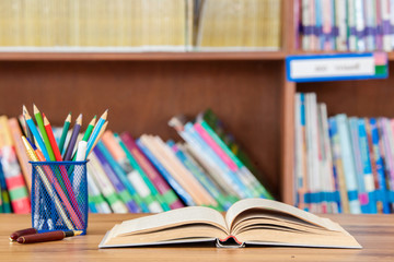 books and office supplies on wood table, work space, Education concept