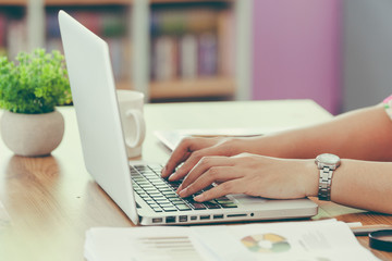 Business woman at have the confidence in a working are beingม Image of business person hands on the keyboard Working at home with laptop