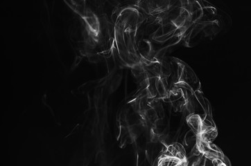 abstract fragment movement of white smoke on black background.