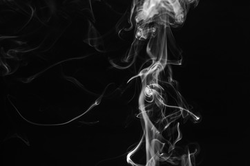 abstract fragment movement of white smoke on black background.