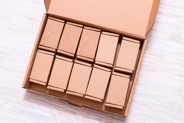 Lot of small cardboard boxes inside of large case with cover