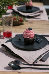 cupcake with berry in the table