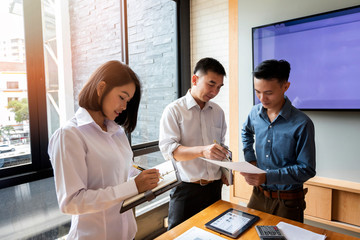 Business team meeting and discussing project plan. Businessmen discussing together in meeting room. Professional investor working with business project together. Finance managers task.