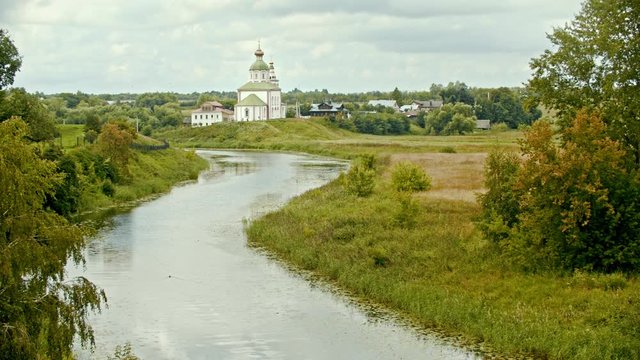 Christian church in the village - river on a foreground - Suzdal, Russia