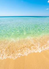 Beautiful sea with turquoise water and golden beach in Salento.