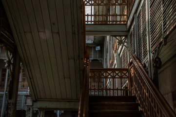 The stairs to the 2nd floor of old city hall, European style building. The vintage white wooden house was left to deteriorate over time, Once be Former city hall.