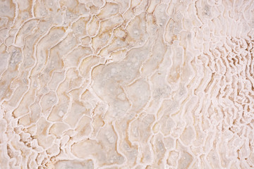 Natural mineral limestone blurred white background. Pamukkale travertine pools surface texture, Turkey