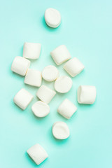Сlose-up of marshmallow on turquoise background